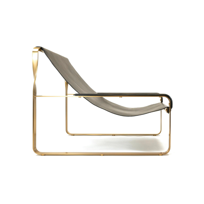 Handmade Wanderlust leather and metal chaise longue on a white background